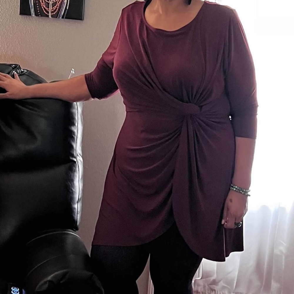 Burgundy 3/4 sleeved blouse, mock tie at front, meant to be worn long.